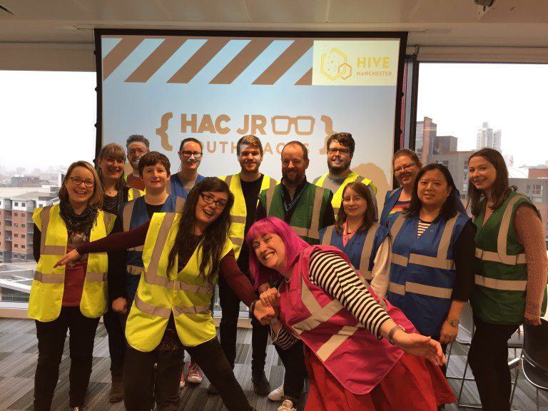 The staff pose for a photo